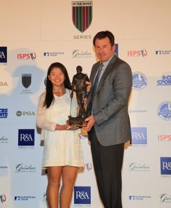 Megan Khang receives the 2013 Faldo Series trophy from Sir Nick Faldo.
