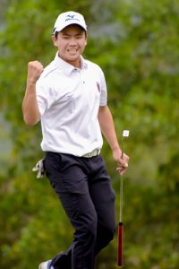 Napat celebrates his winning putt.