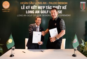 Phan Dinh Tan shakes hands with Sir Nick Faldo low